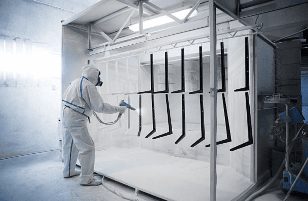 person applying powder coating