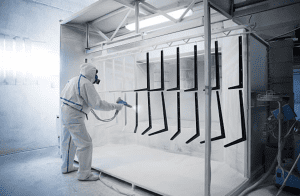 person applying powder coating